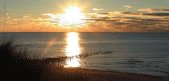 Click for a view of the sunset at the old channel entrance.